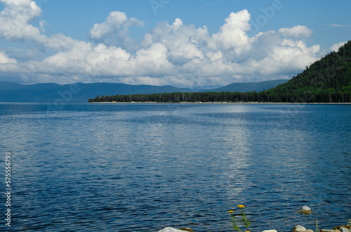 Bay on Lake Baikal in quiet sunny weather. Drawing of currents on the water.