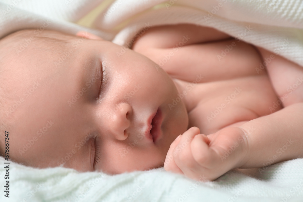 Cute newborn baby sleeping on white blanket, closeup Cute newborn baby sleeping on white blanket, closeup
