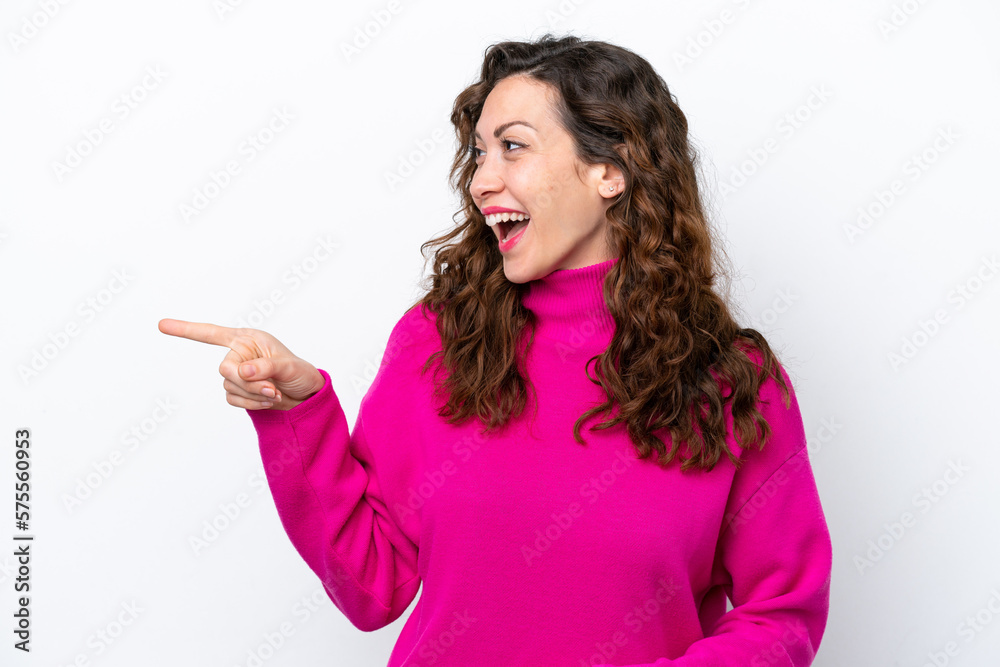 Young caucasian woman isolated on white background pointing finger to the side and presenting a product Young caucasian woman isolated on white background pointing finger to the side and presenting a product