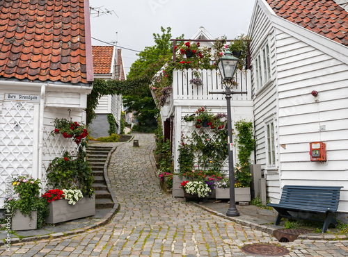 Street with white wooden houses in old centre of Stavanger, Norway