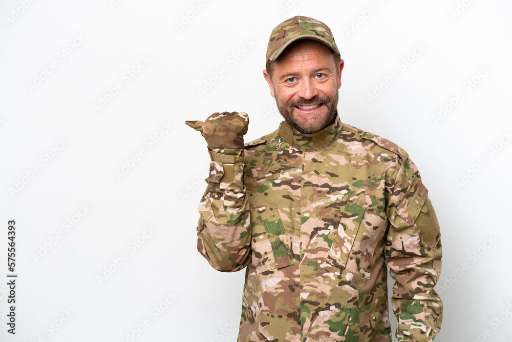 Military man isolated on white background pointing to the side to present a product Military man isolated on white background pointing to the side to present a product
