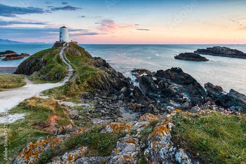 The picturesque Twr Mawr lighthouse  on the island of Ynys Llanddwyn in Anglesey, North Wales. photo