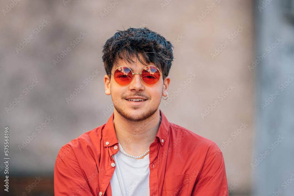 young man with sunglasses on the street young man with sunglasses on the street