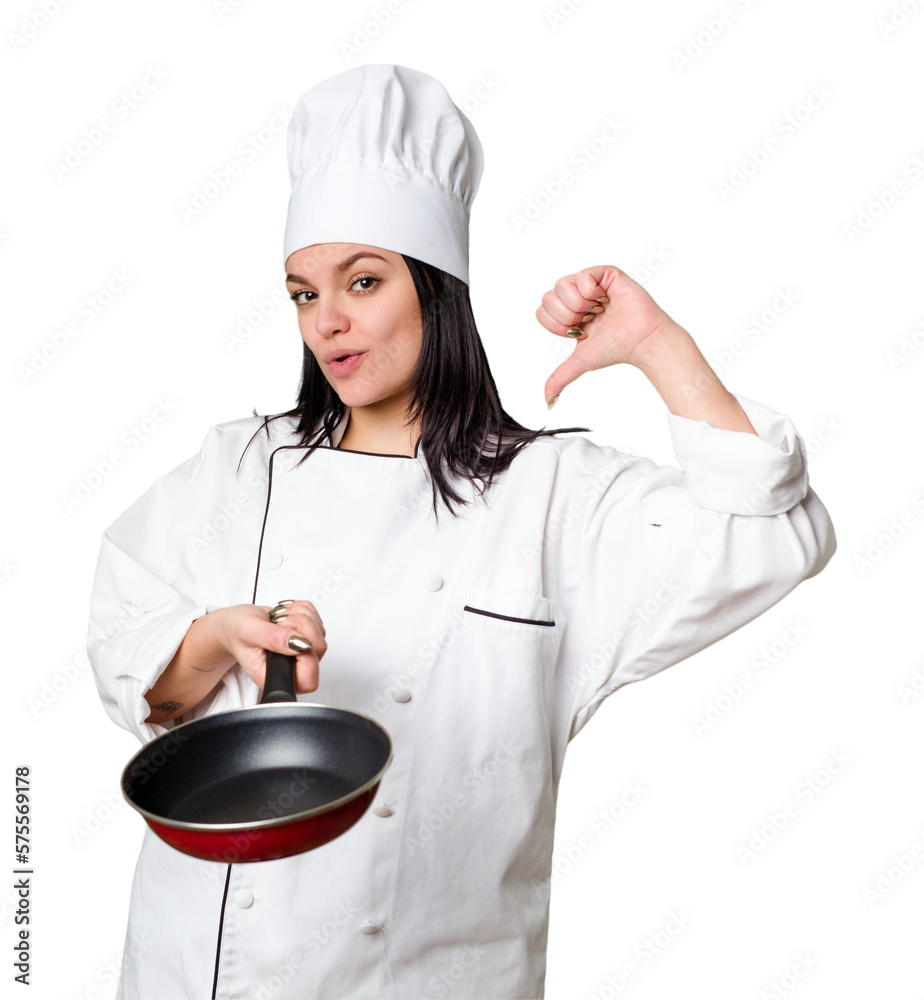 Young cook woman holding a frying pan isolated Young cook woman holding a frying pan isolated