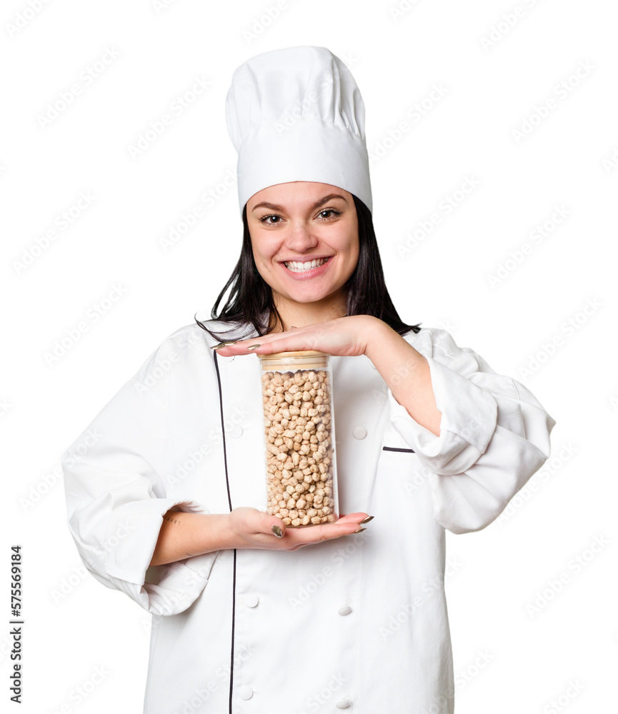 Young cook woman holding chickpeas isolated Young cook woman holding chickpeas isolated