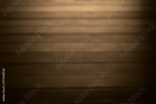 Abstract blurry dark wooden wall background.