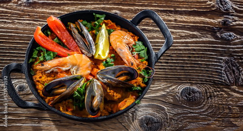 Seafood paella served in a cast iron pan