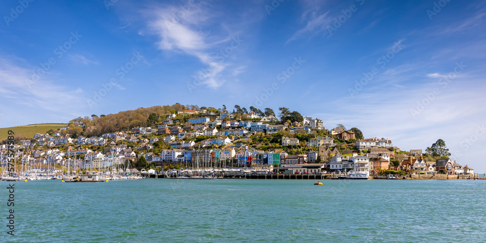 A panoramic view of Kingswear and its colourful buildings from across the River Dart in Dartmouth, Devon. - obrazy, fototapety, plakaty 