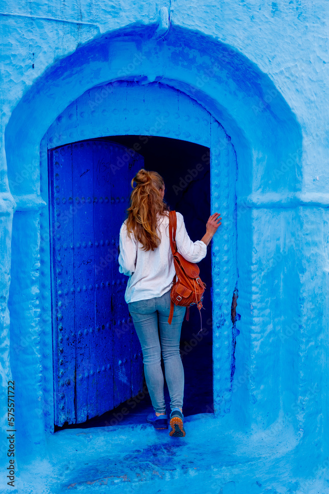 Woman Tourist in Chefchaouen city,  Morocco- Blue city