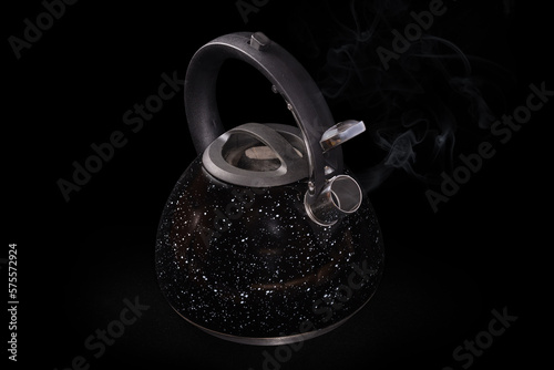Fototapeta Naklejka Na Ścianę i Meble -  Stainless steel stovetop kettle with steam whistle on black background
