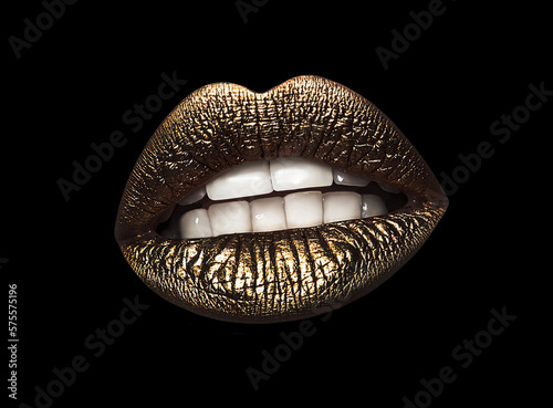 Beautiful lips with shiny golden lipstick on black background