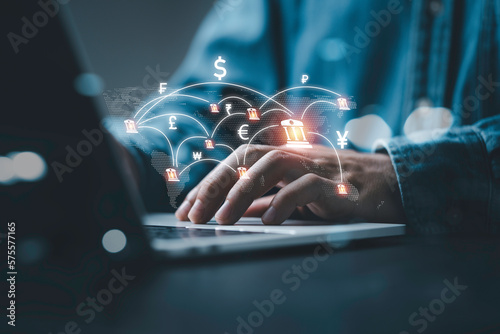 Photographie Businessman using computer virtual screen  with central banking and international currency include dollar Yuan Yen Pound sterling and Euro for forex and currency exchange money transfer concept