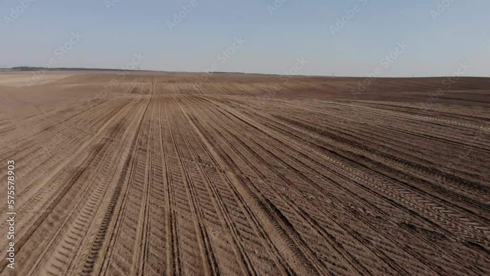 Green tractor planting sunflower on the sandy field in Ukraine 4K Green tractor planting sunflower on the sandy field in Ukraine 4K