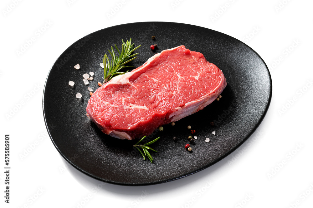 Fresh raw beef steak with spices isolated on white background