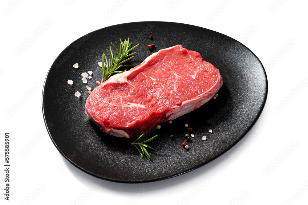 Fresh raw beef steak with spices isolated on white background Fresh raw beef steak with spices isolated on white background