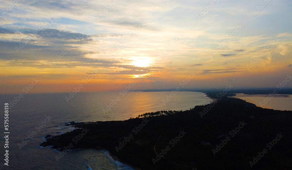 Aerial view of the tropical sea sunset. Beautiful evening wallpaper for tourism and advertising. Asian landscape, drone photo