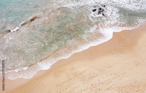 Aerial view of the tropical ocean landscape with a beach. Beautiful southern sea wallpaper for tourism and advertising. Asian landscape, drone photo