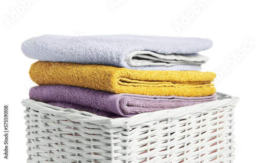 Wicker laundry basket with folded towels isolated on white