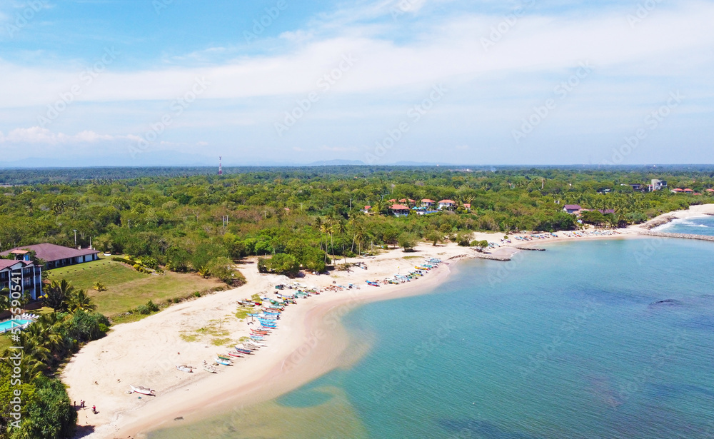 Aerial view of the tropical ocean landscape with a beach. Beautiful southern sea wallpaper for tourism and advertising. Asian landscape, drone photo