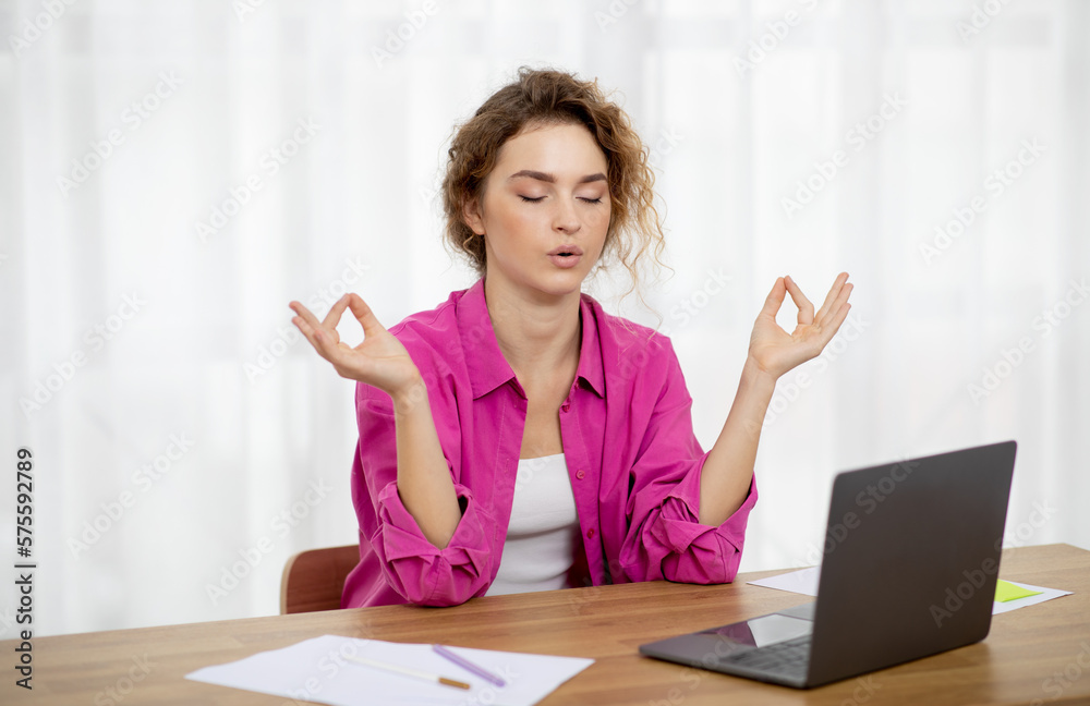 Zen Concept. Female Freelancer Sitting At Desk And Meditating With Eyes Closed