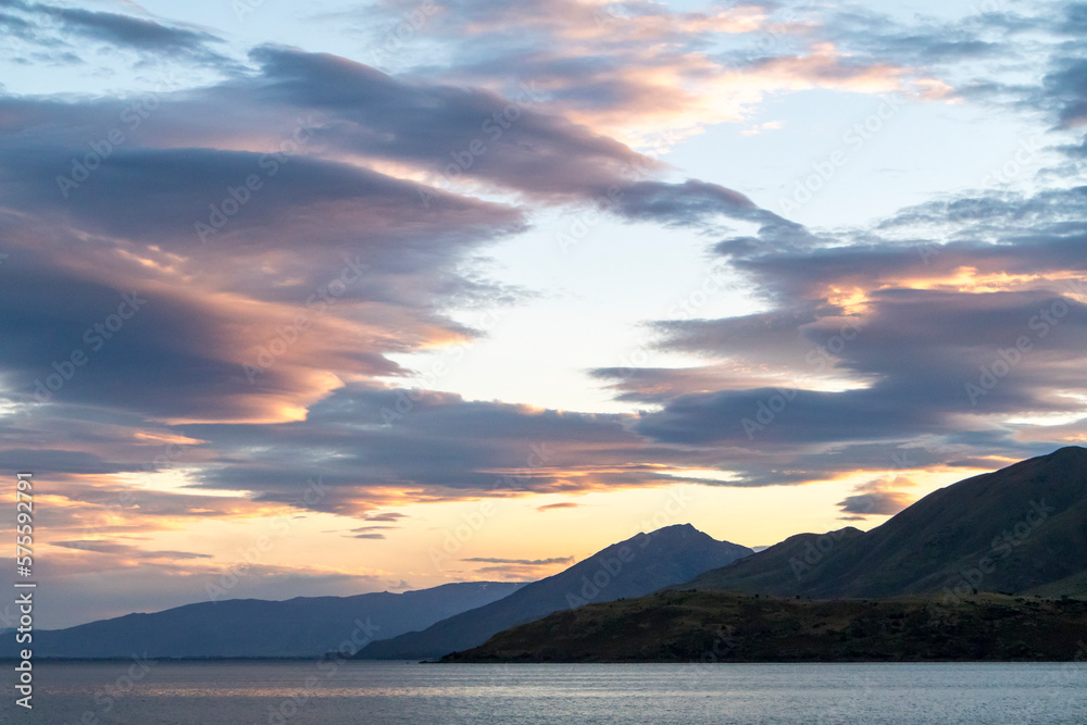 Clouds in sunset above the mountains in Lake Hawea, New Zealand 