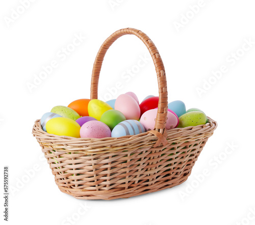 Wicker basket with beautifully painted Easter eggs isolated on white