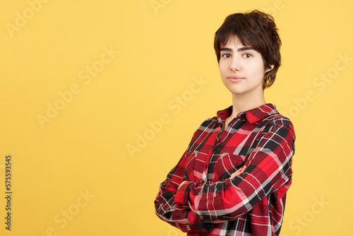 Tableau sur toile Serious androgynous person standing with arms crossed