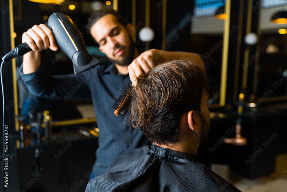 Professional hairstylist working at the salon Professional hairstylist working at the salon