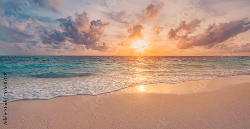 Closeup sea sand beach. Beautiful beach landscape. Inspire tropical beach seascape horizon. Dreamy sunset sky calm tranquil relax sunrise summer mood. Positive energy meditation summer tropical island © icemanphotos