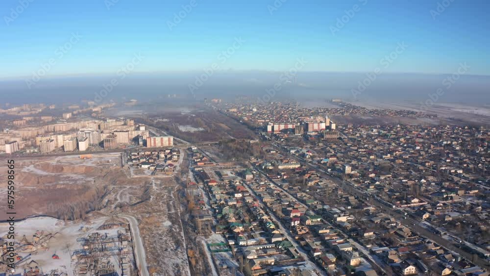 Flight over the houses and industrial zone of the smog-covered suburb of Bishkek against the backdrop of the smog-covered city Flight over the houses and industrial zone of the smog-covered suburb of Bishkek against the backdrop of the smog-covered city