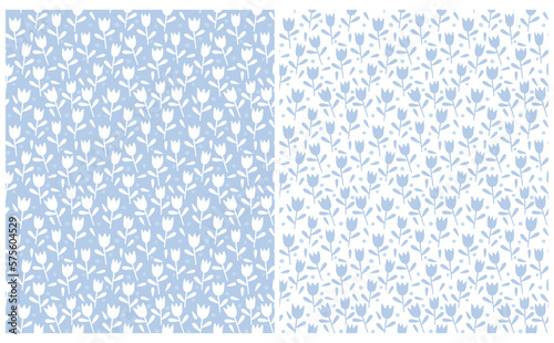 Cute Hand Drawn Floral Vector Patterns. Simple Tulips Isolated on a White and Light Blue Background. Infantile Style Floral Print ideal for Wrapping Paper, Fabric. Lovely Abstract Garden Print. #575604529