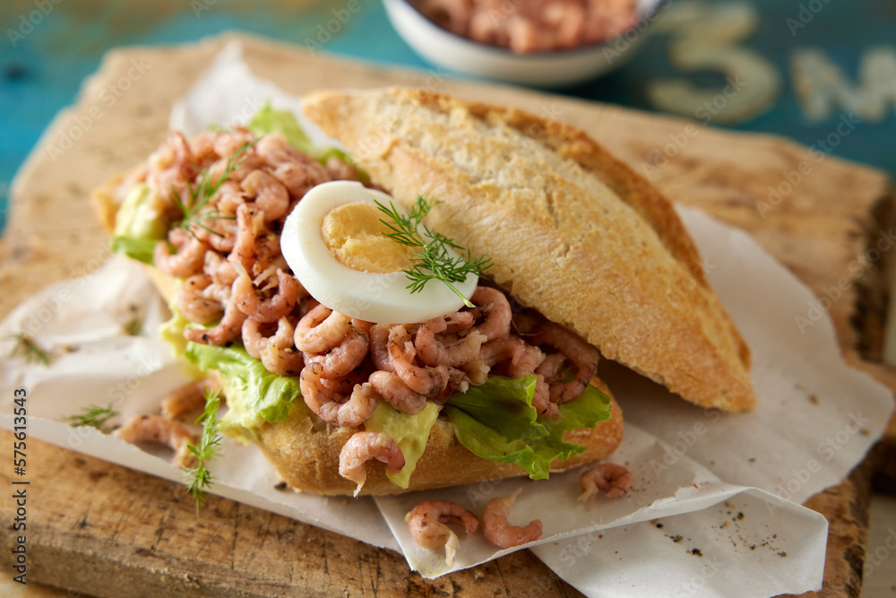 Healthy sandwich with shrimps and egg on wooden board Healthy sandwich with shrimps and egg on wooden board