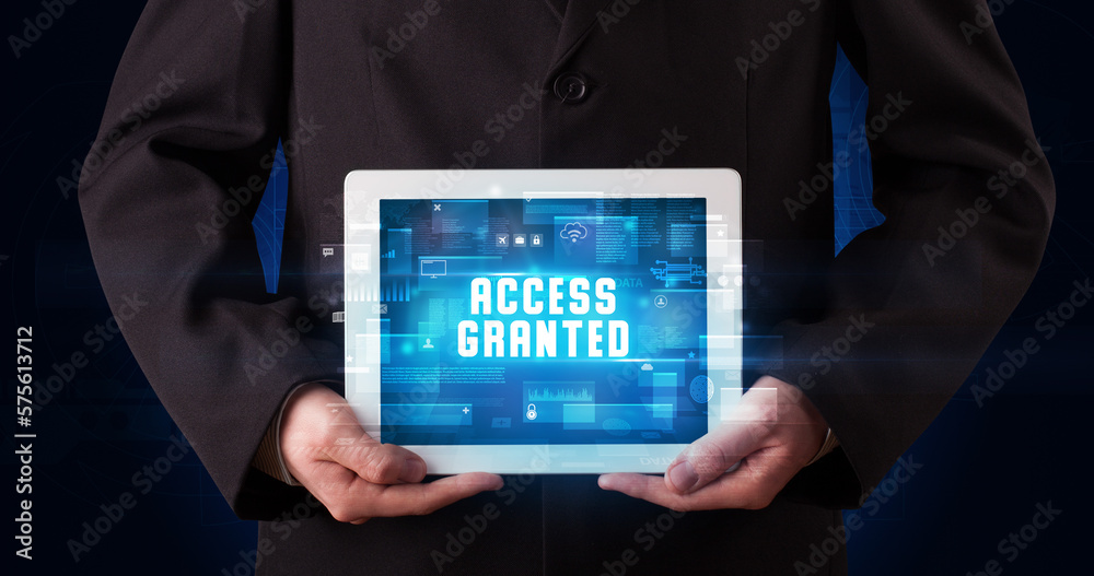 Person holding tablet, security concept Person holding tablet, security concept