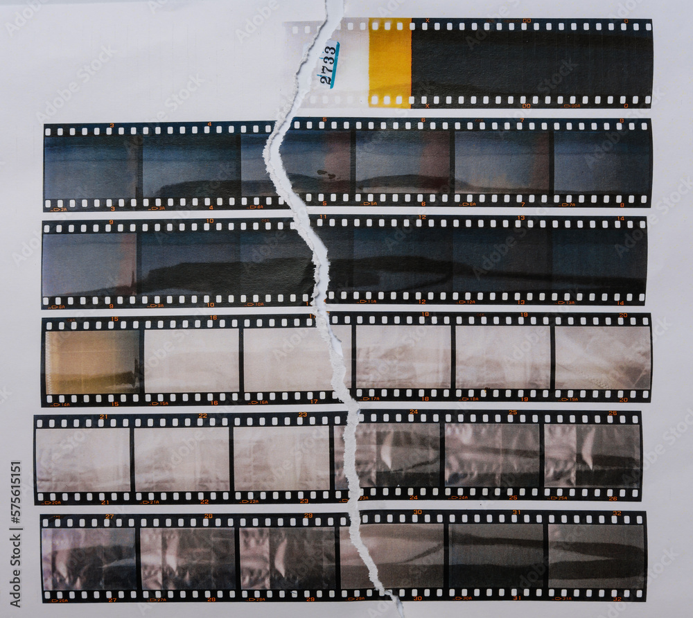 Obraz premium 35mm filmstrips printed on white torn copy paper, cool cover or poster idea, empty or blank film material.