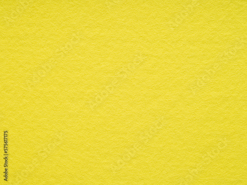 Bright yellow matt felt material blank. Surface of felted fabric texture background. High resolution photo. Pattern for text, lettering, 3d, patchworkor other art work. Full frame backdrop wallpaper.