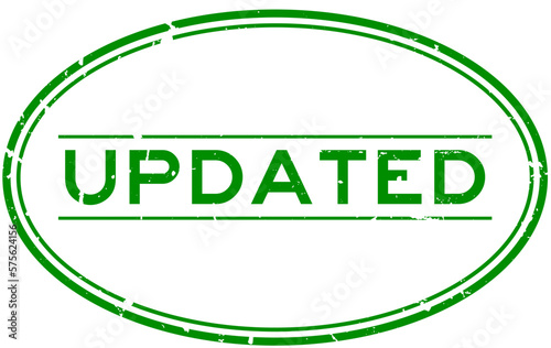 Grunge green updated word oval rubber seal stamp on white background