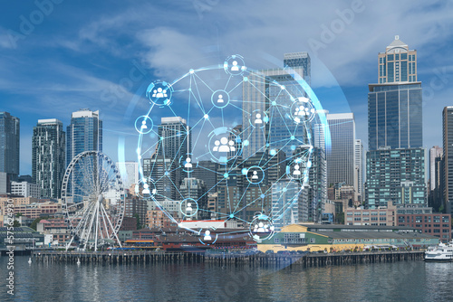 Seattle skyline with waterfront view. Skyscrapers of financial downtown at day time, Washington, USA. Social media hologram. Concept of networking and establishing new people connections