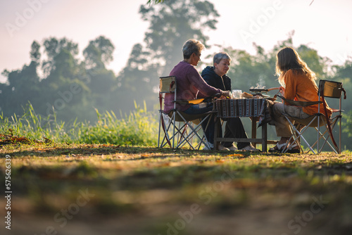 mother and children lifestyle in vacation camping concept, nature, woman person family are happy fun to eating picnic breakfast food at outdoors summer travel, girl with adventure trip holiday leisure
