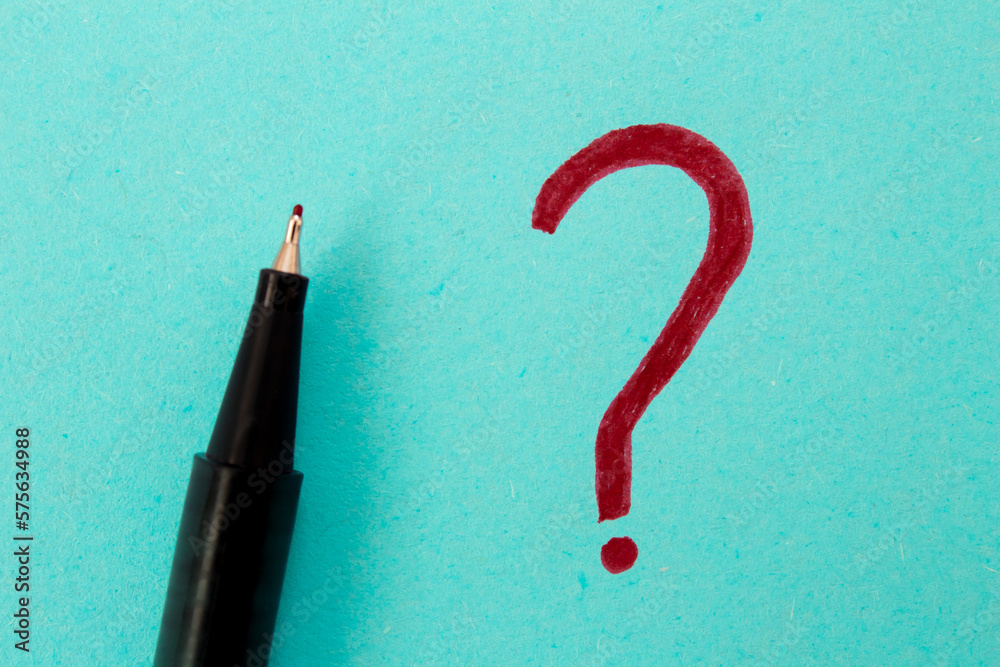 Question mark drawn on a blue paper. Curiosity, uncertainty and confusion concepts. Conceptual image. Question mark drawn on a blue paper. Curiosity, uncertainty and confusion concepts. Conceptual image.