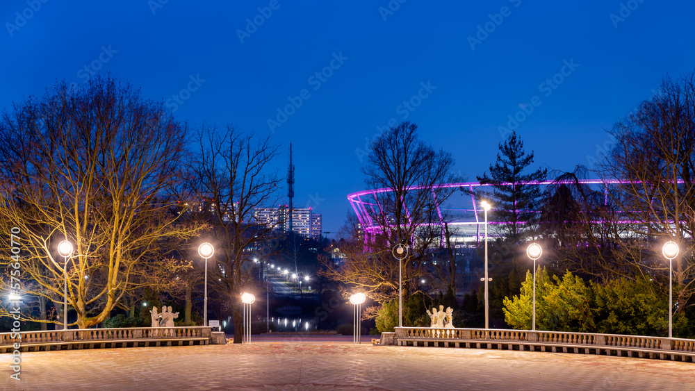Silesian Park in Chorzów. Dance circle after renovation. A stone floor surrounded by an auditorium. Silesian Stadium in the background