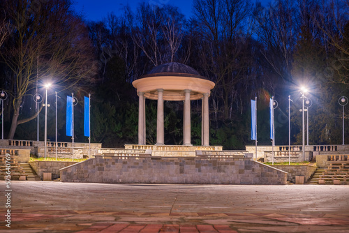 Silesian Park in Chorzów. Dance circle after renovation. A stone floor surrounded by an auditorium. Gloriette in the background