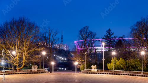 Obraz na płótnie Silesian Park in Chorzów. Dance circle after renovation. A stone floor surrounded by an auditorium. Silesian Stadium in the background w salonie