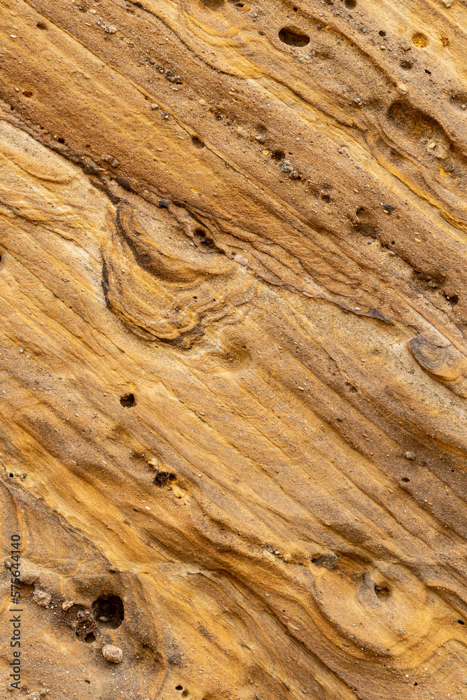 Fototapeta premium Natural rock texture background on the Santa Cruz beach in the center of Portugal