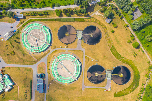 Aerial view of modern water cleaning facility at urban wastewater treatment plant. Purification process of removing undesirable chemicals, suspended solids and gases from contaminated liquid