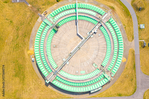 Aerial view of modern water cleaning facility at urban wastewater treatment plant. Purification process of removing undesirable chemicals  suspended solids and gases from contaminated liquid