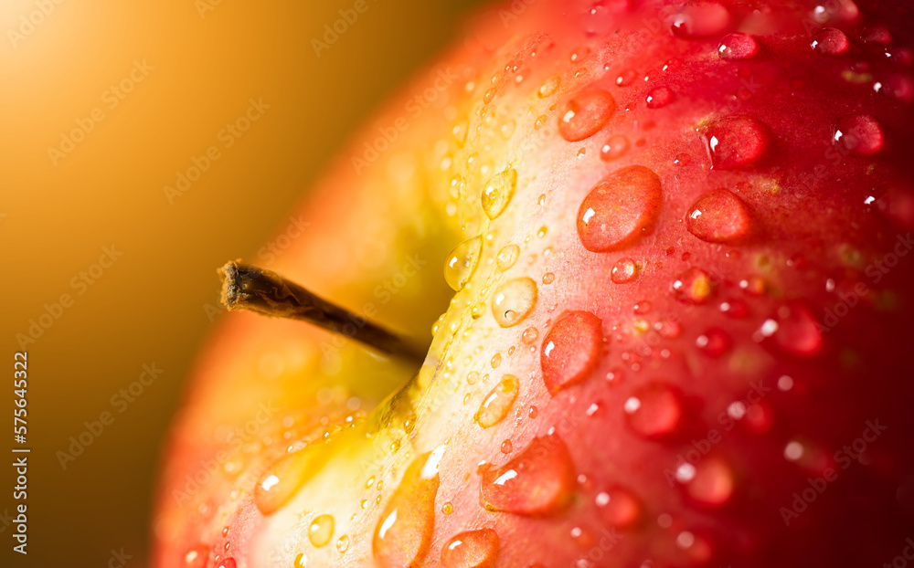 Macro red apple in water drops with blurry background. Macro red apple in water drops with blurry background.