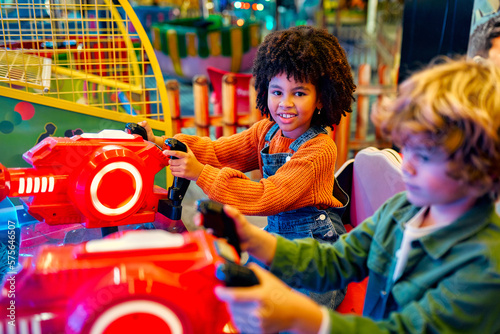 Kids having fun on a carnival Carousel photo