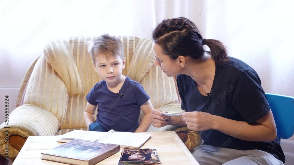Mom and son draw and record interviews while looking at photos Mom and son draw and record interviews while looking at photos