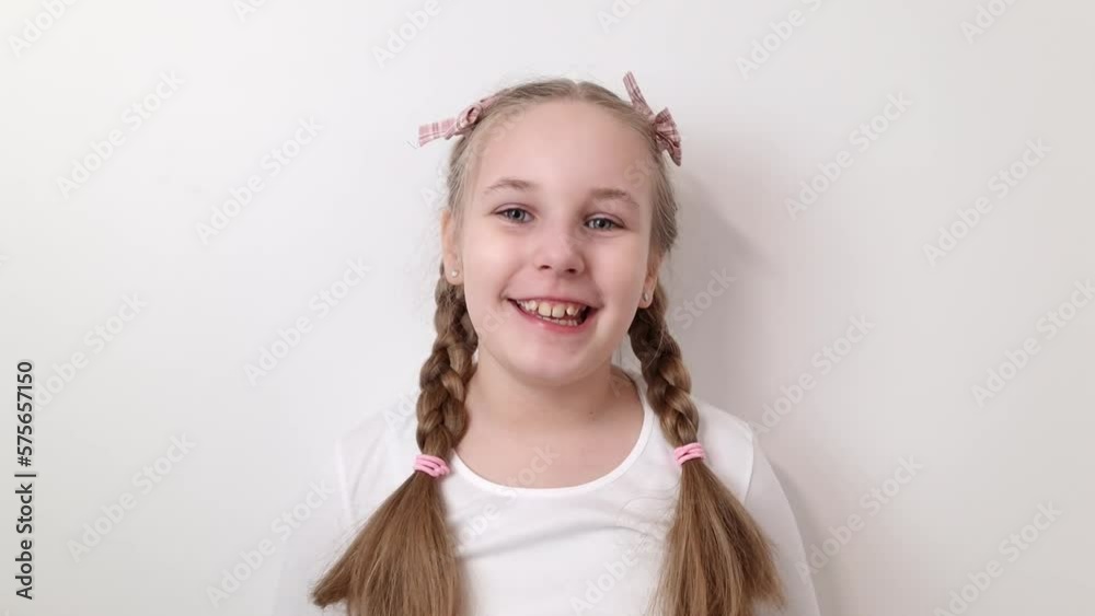 Portrait of happy smiling little child girl isolated on white background. Beauty, children`s fashion concepts Portrait of happy smiling little child girl isolated on white background. Beauty, children`s fashion concepts