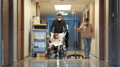 A child with his parents in the hospital after a kidney transplant photo